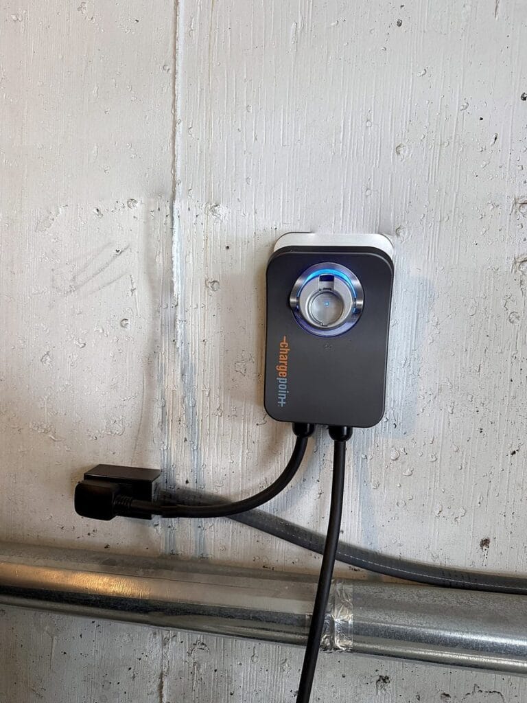 ChargePoint Home Flex EV charger mounted on a garage wall and plugged into a NEMA 14-50 outlet