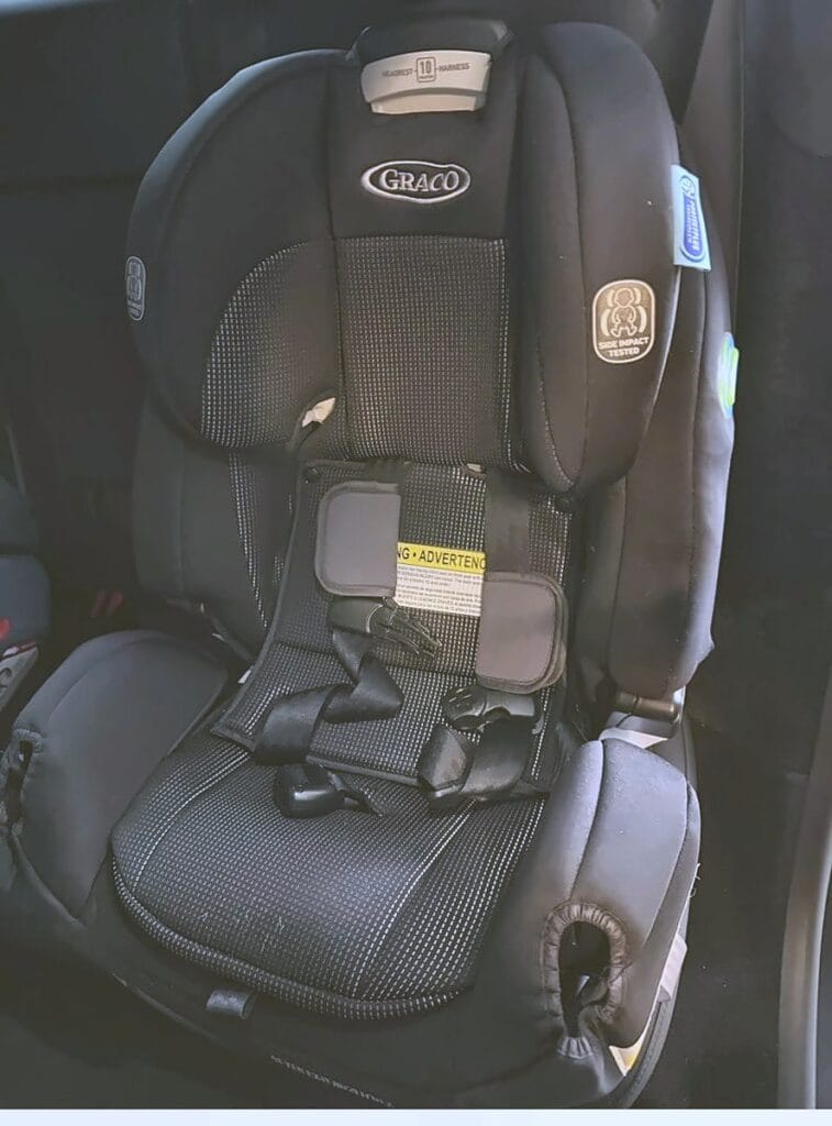Close-up of a Graco 4Ever Extend2Fit forward-facing in a Tesla Model Y