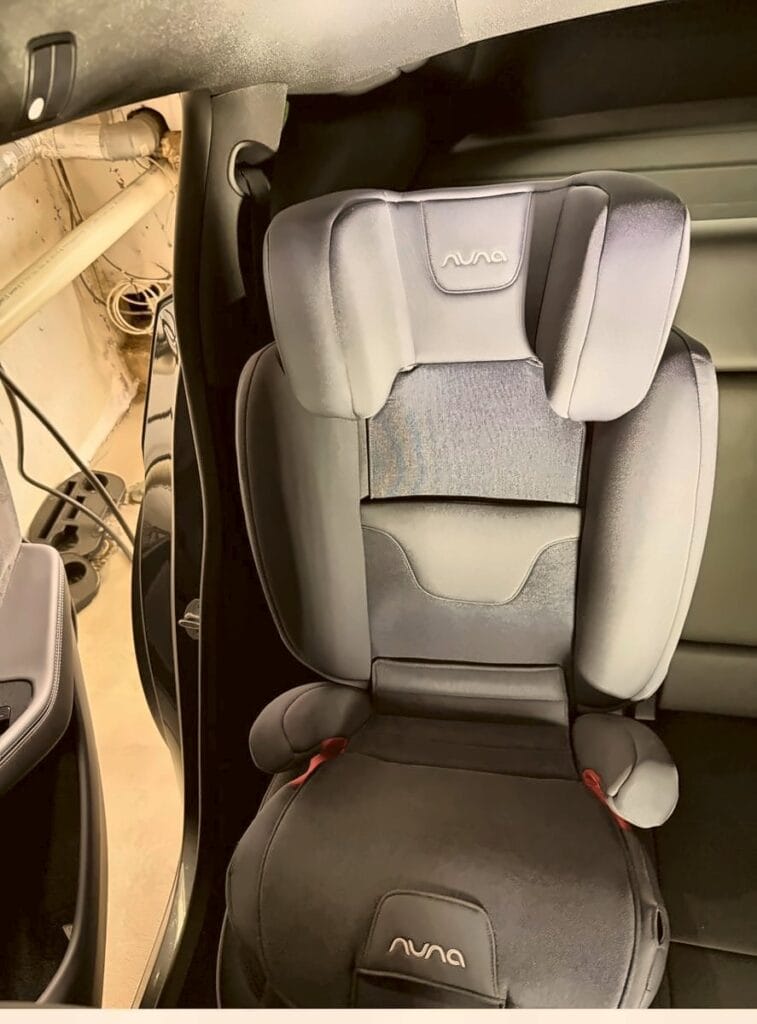 Nuna Aace booster in a Tesla Model Y, viewed from the open rear door