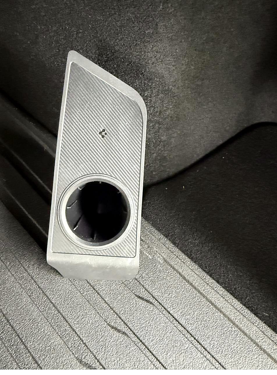 Spigen J1772 adapter holder on the Tesla Model Y trunk mat, empty