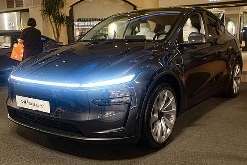 2025 redesigned Tesla Model Y in Stealth Grey, exterior view