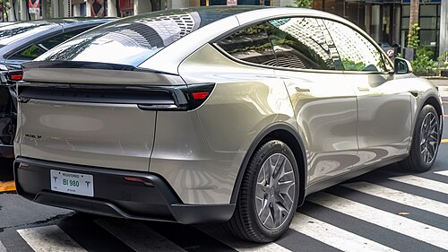 Tesla Model Y L, the longer 6-seat 3-row variant, in Cosmic Silver