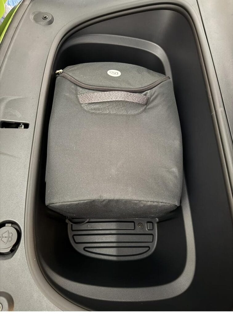 WAYB Pico in its carry bag stored in the Tesla Model Y frunk