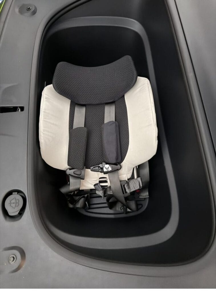 Folded WAYB Pico car seat in the Tesla Model Y frunk