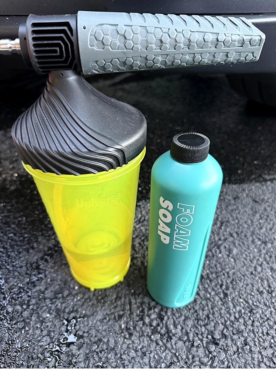 Foam cannon bottle next to a bottle of foam soap